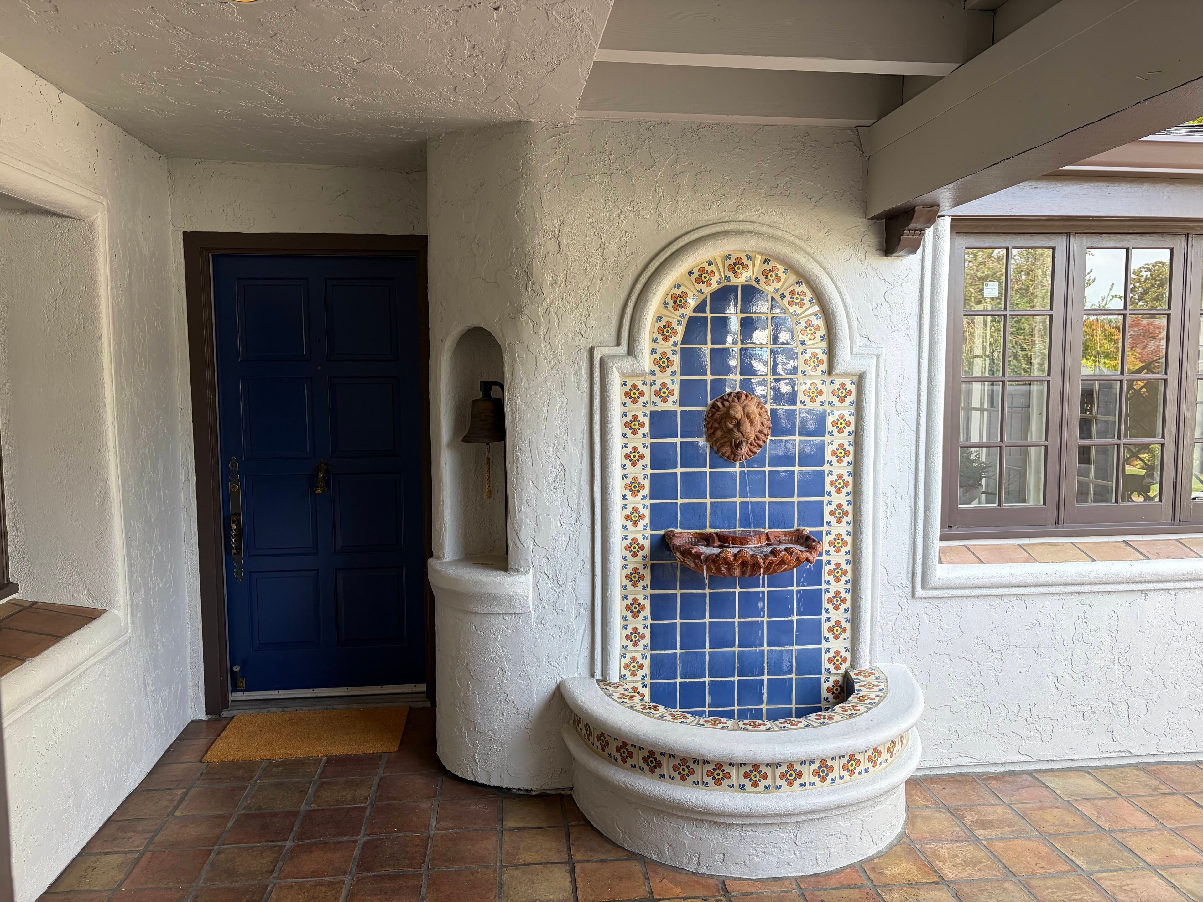 Gated private courtyard with Spanish tile and fountain